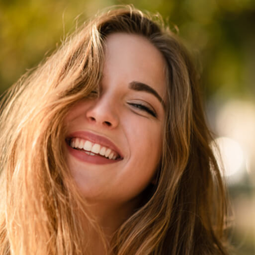 Woman smiling outside